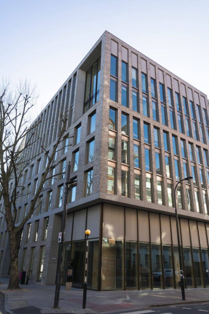 A large building with windows on the side of it.