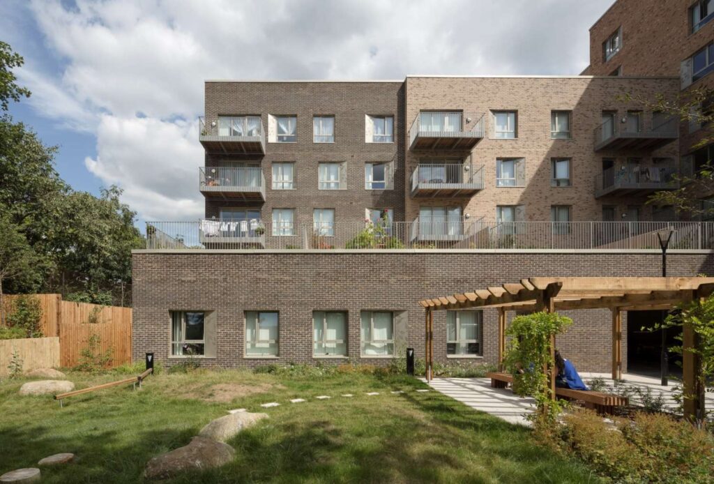 A MCP1040 building with a wooden deck and a grassy area.