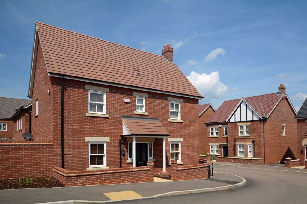 A MCP1132 house in the middle of a street.