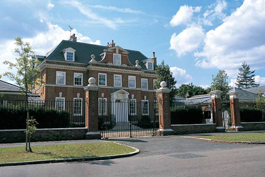 A large MCPB180 house with a gate in front of it.