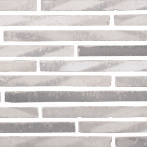 A white and gray brick wall with a white and gray pattern.