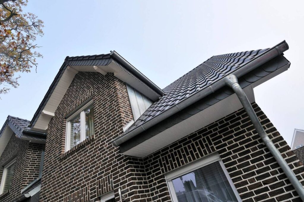 A brick house with MCP4033 gutters.