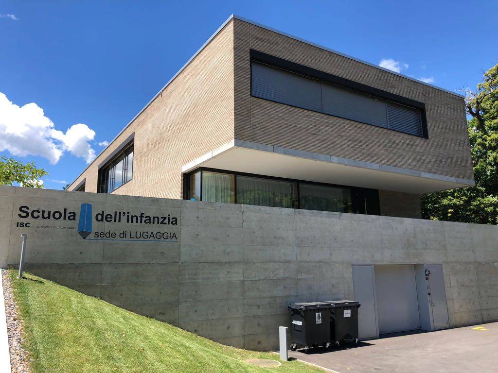 Modern MCPV352 school building with a large sign reading 