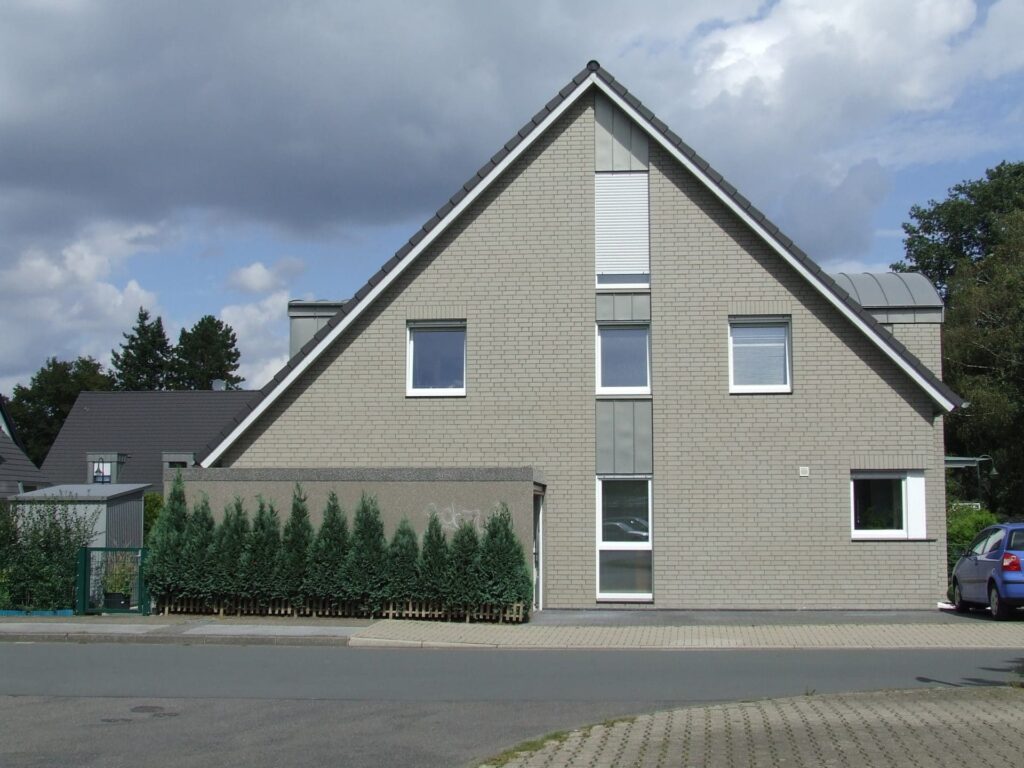 A house with an MCP2317 parked in front of it.