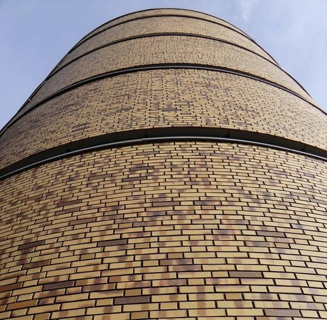 Rostock project 6 close up pan up curved brick building