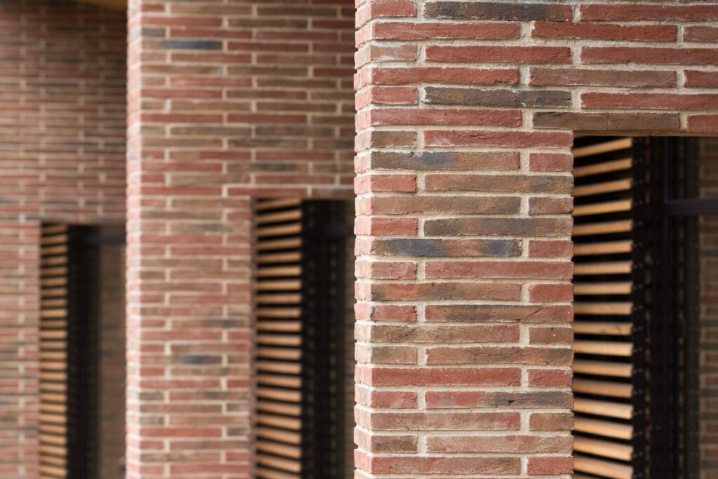 A row of MCPE019 buildings with wooden shutters.