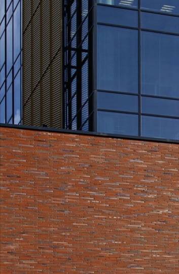 A brick wall with a MCPH036 window on it.