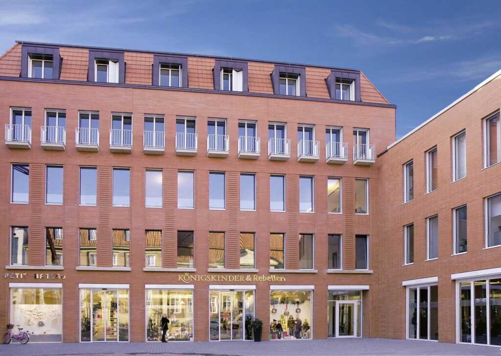 The exterior of an MCPH041 building with many windows.