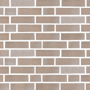 A close up of a beige brick wall.