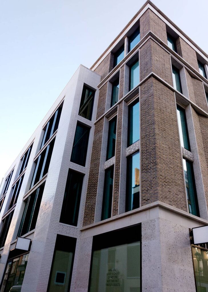 A building with windows on the side of it.