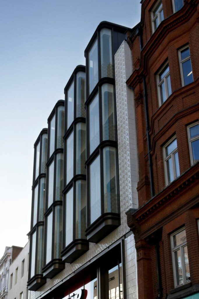 A building with large windows on the side of it.