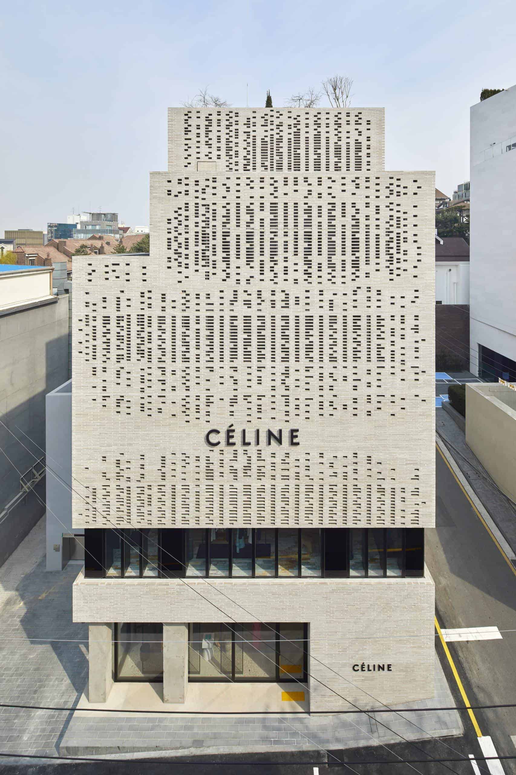Exterior view of the celine flagship store, a modern urban building with a patterned facade and bold signage, situated between other structures.