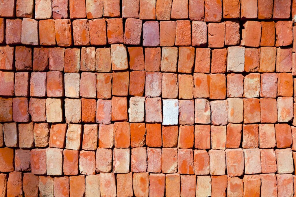 red stapled bricks give a harmonic pattern in the sun