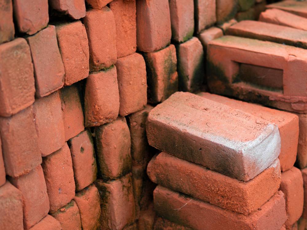 pile of red clay bricks