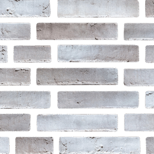 Close-up view of a wall constructed from uniform rectangular gray MCPM100 blocks.