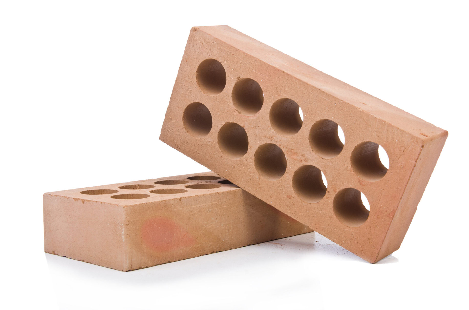 Stack of clay bricks isolated on white Stack of clay bricks for blog photo
