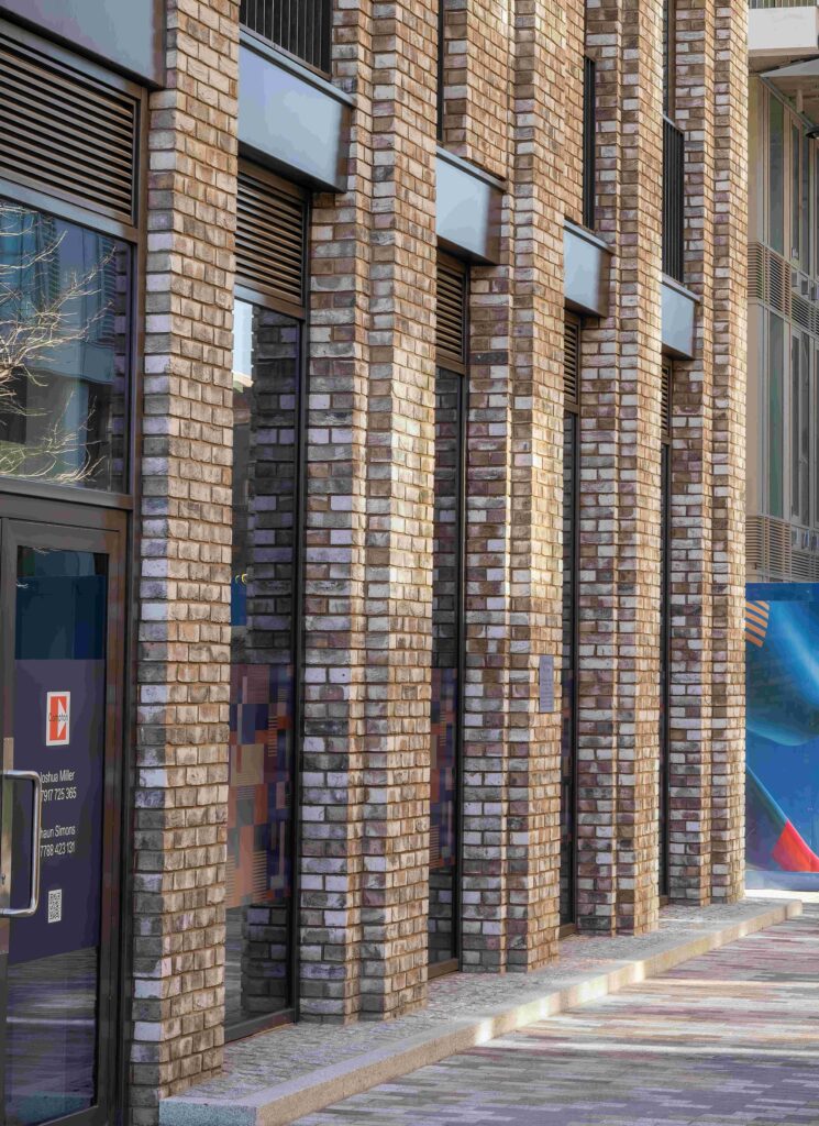 Exterior view of a MCPV187 building with vertical brick columns.