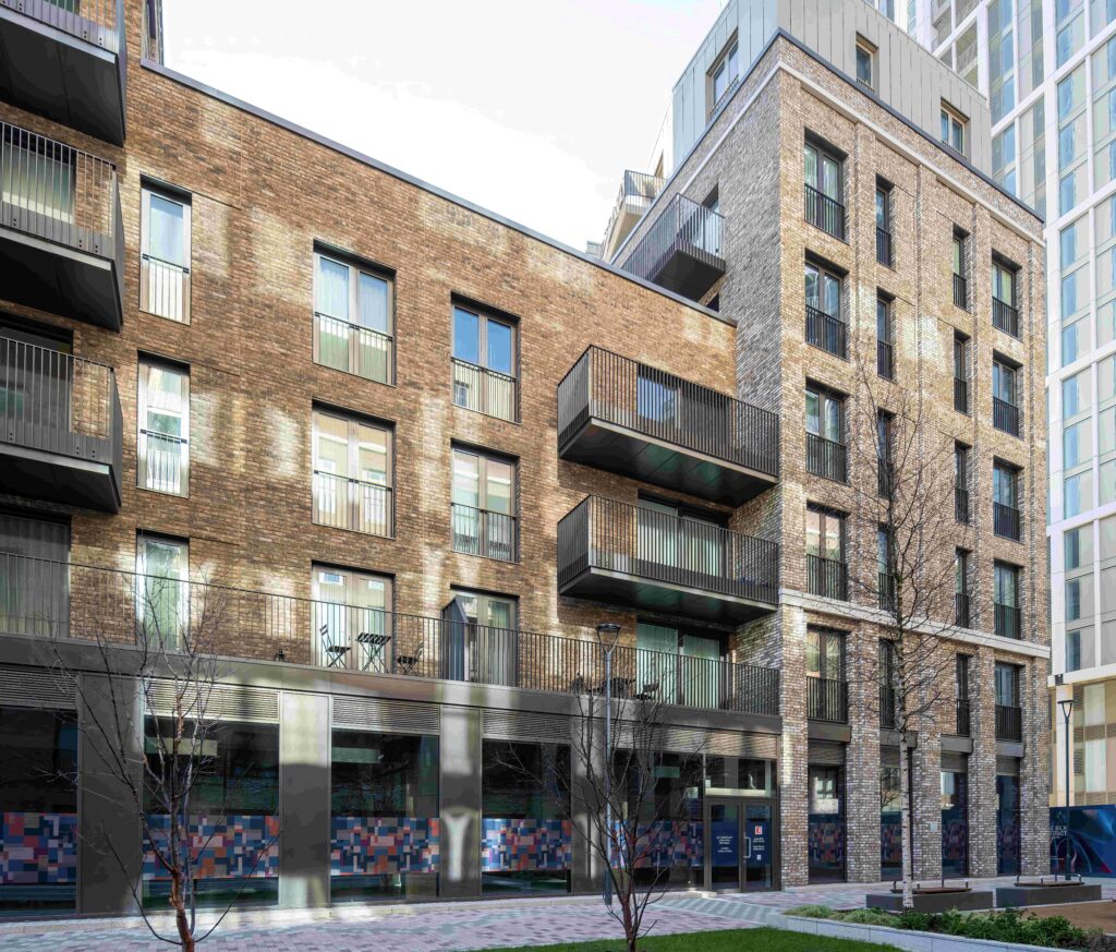 Modern urban apartment buildings with a mix of MCPV187 facades and balconies, set in a landscaped courtyard.