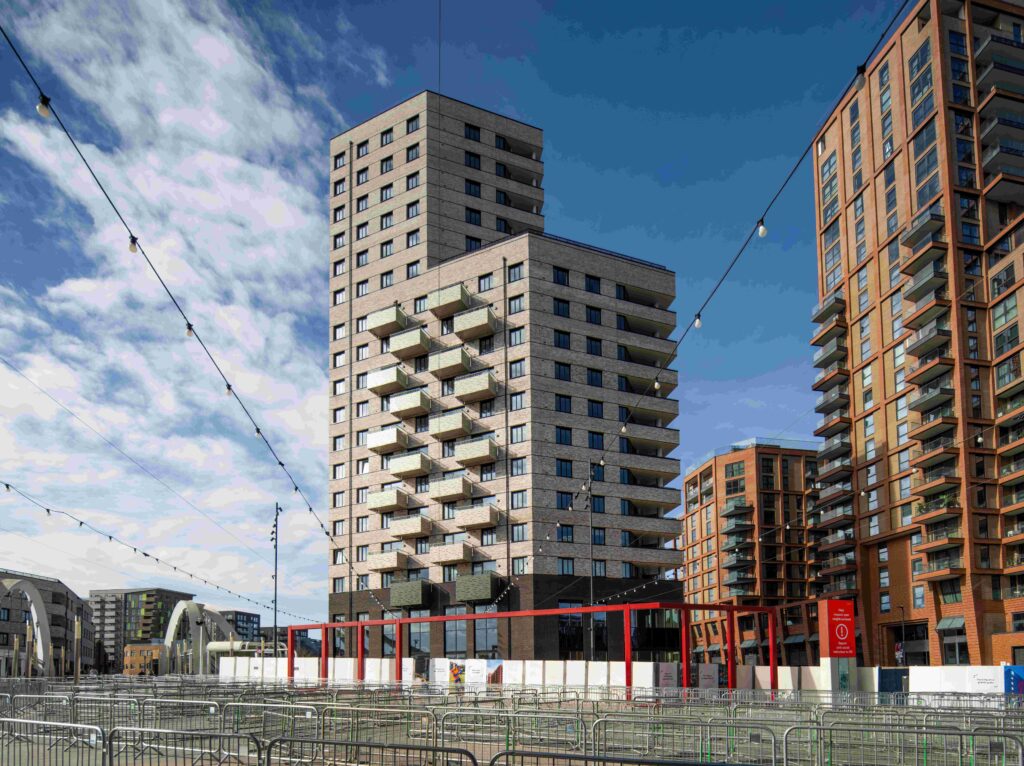 MCPV175 signage and construction barriers are visible at the base of the buildings.