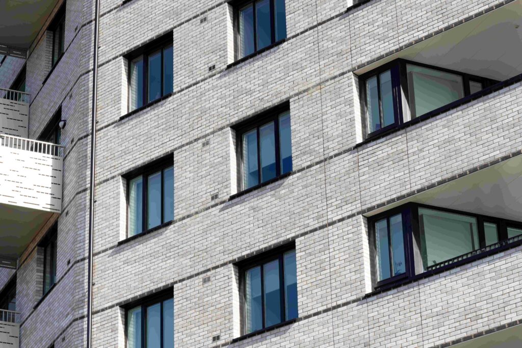 Close-up view of the exterior of a modern apartment building with MCPV175 walls.