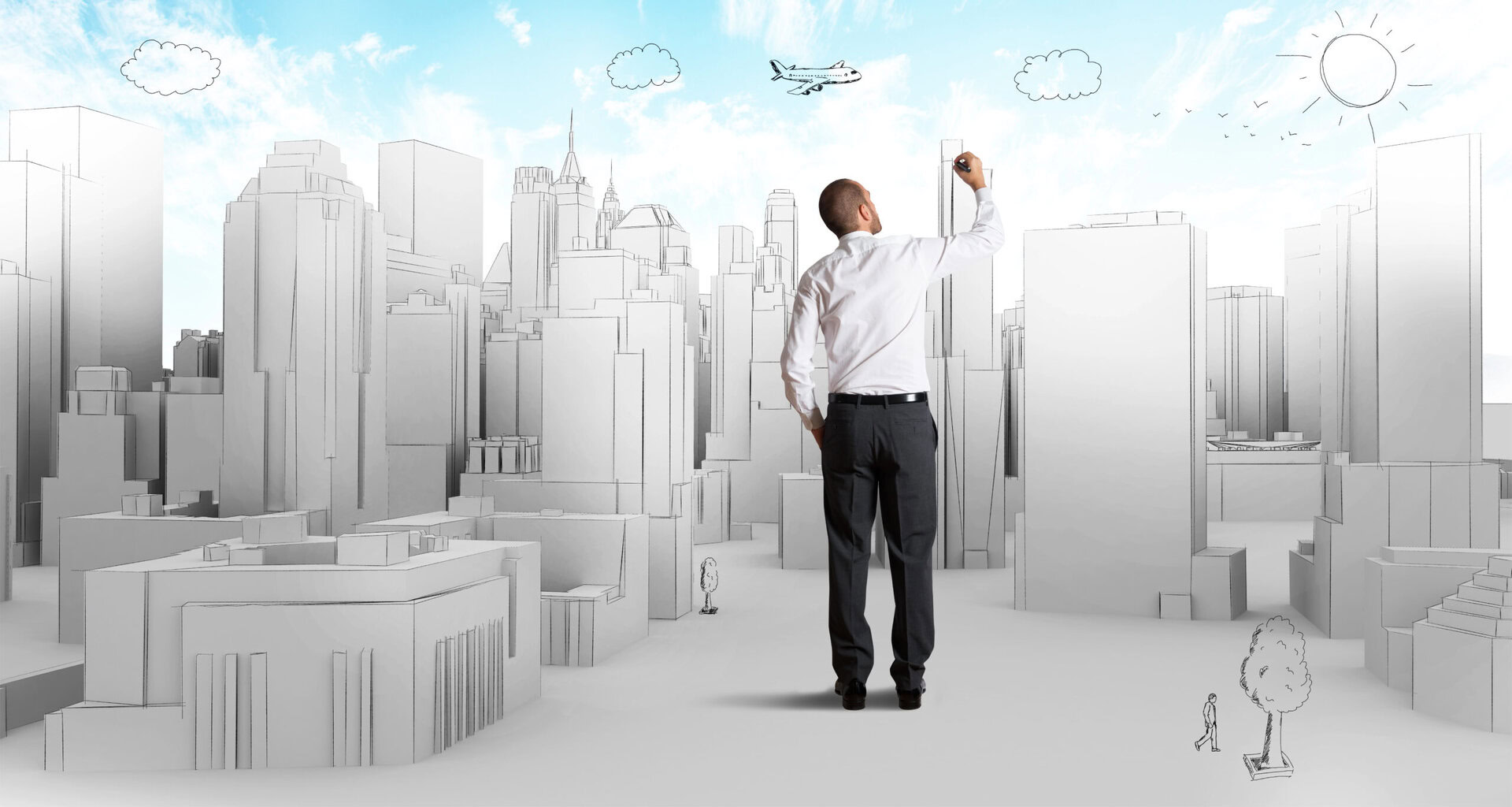 A man in a white shirt draws a cityscape with skyscrapers, clouds, and an airplane on a large canvas or virtual screen.